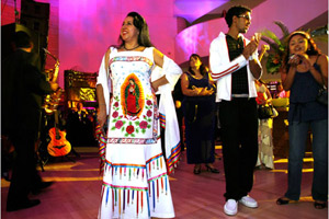 Beatriz Amberman, whose Mexican folkloric performing company strives to educate and promote better understanding of Mexican culture, listens to music at the Smithsonian Latino Center's 10-year anniversary gala and awards ceremony in Washington on September 5. The ceremony celebrated Mexico and Mexican-American achievements. (© AP Images)