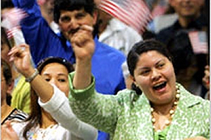 New American citizens cheer after being sworn in at a naturalization ceremony March 22 in Los Angeles, California. (© AP Images)