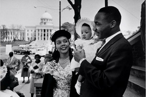 Martin Luther King Jr. stands with his wife, Coretta, and daughter Yolanda in 1956. (© Sandra Weiner/National Portrait Gallery)