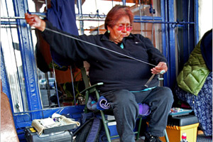 An American Indian artist makes and sells crafts in Albuquerque, New Mexico. (© AP Images)