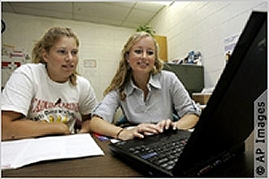 Meghan Bridges, right, an adviser with the National College Advising Corps, counsels Morgan Andrews on her college choices.