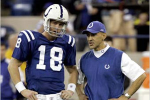 Indianapolis Colts head coach Tony Dungy, right, chats with quarterback Peyton Manning. Dungy, along with Chicago Bears head coach Lovie Smith, is the first black to coach the Super Bowl. (© AP Images)