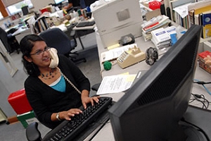 Malavika Jagannathan, Green Bay Press-Gazette reporter, new citizen, and new voter, at work in the newsroom. Courtesy of Malavika Jagannathan
