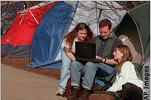 Some Americans check their work e-mail accounts while on vacation by using wireless Internet connections.