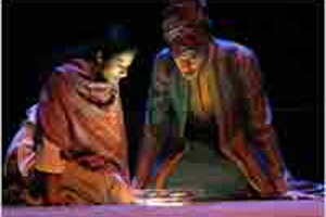 Anu Yadav as Nassrin and Ed Chemaly as Baba Kharkan in On the Eve of Friday Morning (Carol Pratt, courtesy of Shakespeare Theatre)