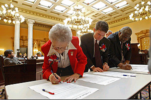 Ohio's delegation to the Electoral College certify their votes during the voting ceremony in the Columbus statehouse in December 2004.  © AP Images/Will Shilling